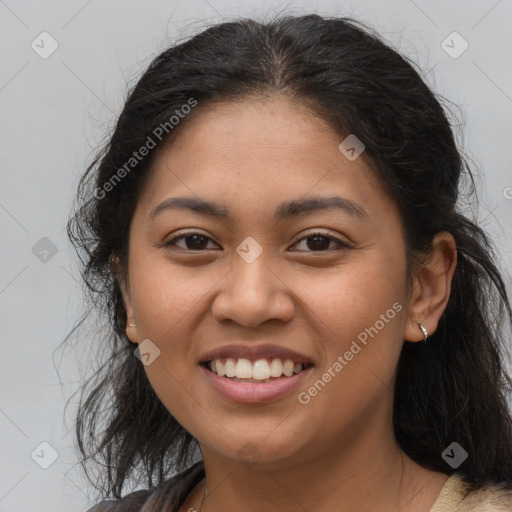 Joyful latino young-adult female with medium  brown hair and brown eyes