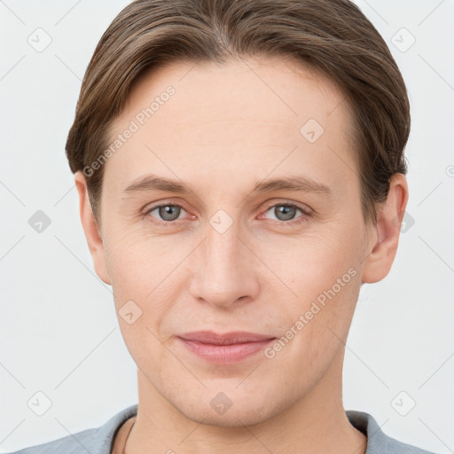 Joyful white young-adult female with short  brown hair and grey eyes