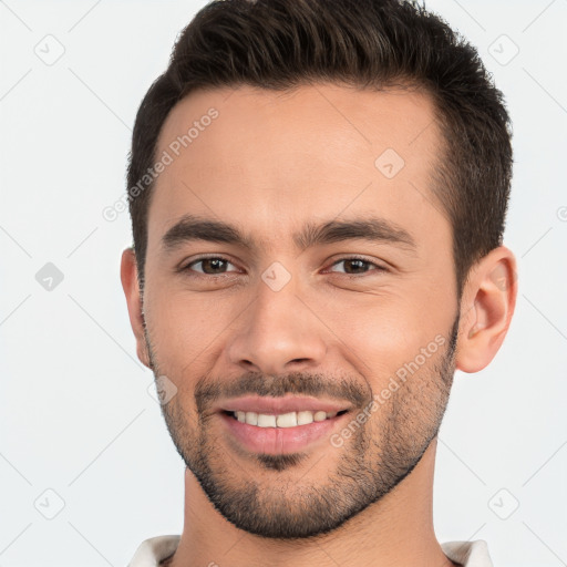 Joyful white young-adult male with short  brown hair and brown eyes