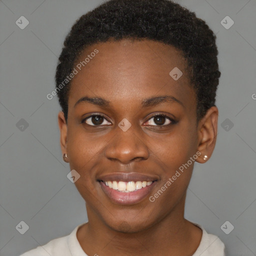 Joyful black young-adult female with short  brown hair and brown eyes