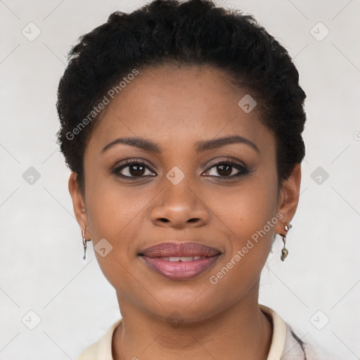 Joyful black young-adult female with short  brown hair and brown eyes