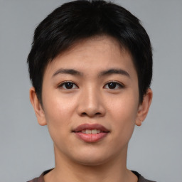 Joyful asian young-adult female with short  black hair and brown eyes