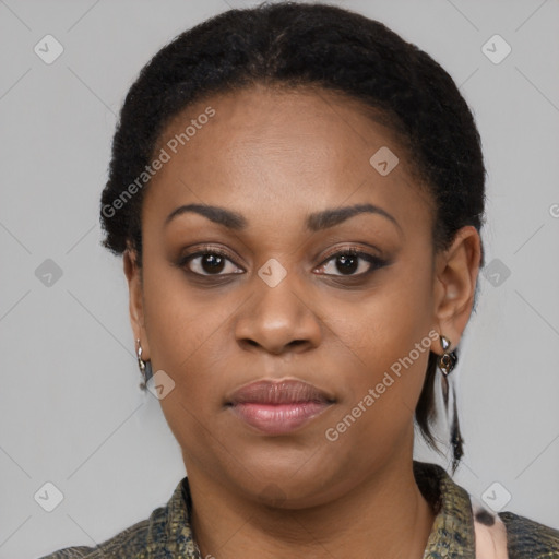 Joyful black young-adult female with short  black hair and brown eyes