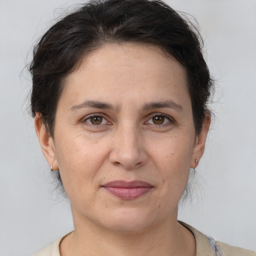 Joyful white adult female with short  brown hair and brown eyes