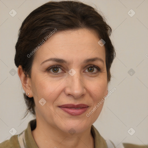 Joyful white adult female with medium  brown hair and brown eyes