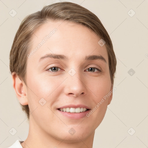 Joyful white young-adult female with short  brown hair and grey eyes