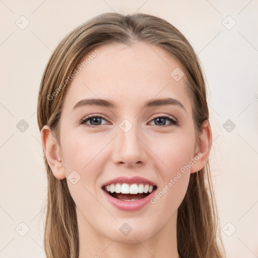 Joyful white young-adult female with long  brown hair and green eyes