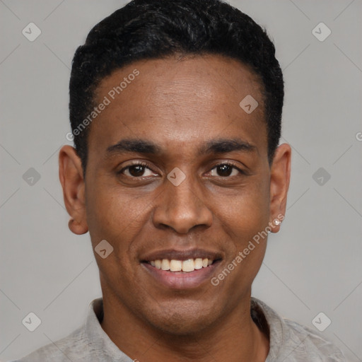Joyful latino young-adult male with short  black hair and brown eyes