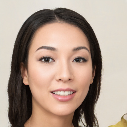 Joyful white young-adult female with long  black hair and brown eyes