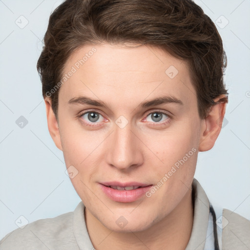 Joyful white young-adult female with short  brown hair and grey eyes