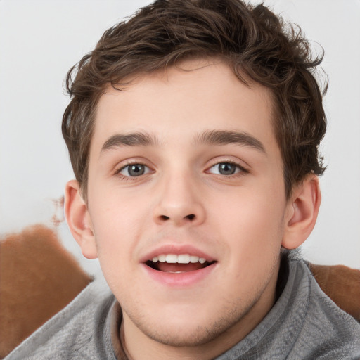 Joyful white child male with short  brown hair and brown eyes