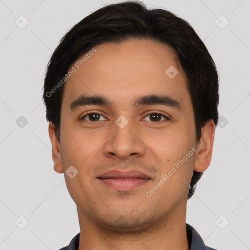 Joyful latino young-adult male with short  black hair and brown eyes