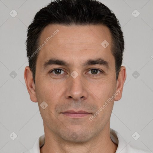 Joyful white young-adult male with short  black hair and brown eyes