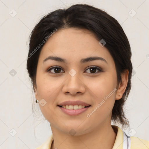 Joyful latino young-adult female with medium  brown hair and brown eyes