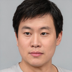 Neutral asian young-adult male with short  black hair and brown eyes