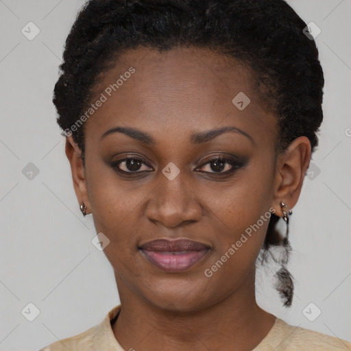 Joyful black young-adult female with short  black hair and brown eyes