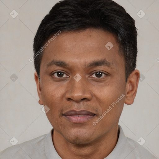 Joyful black young-adult male with short  brown hair and brown eyes