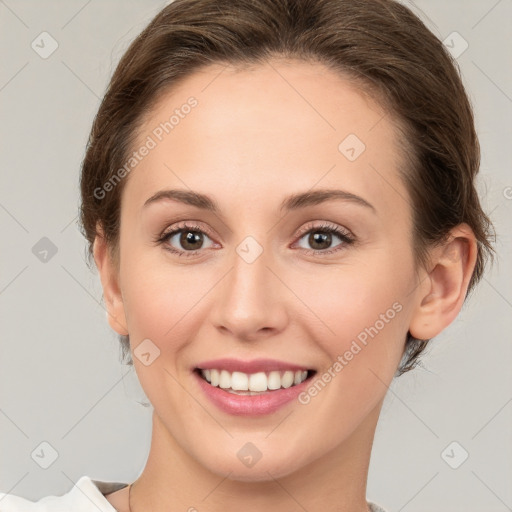 Joyful white young-adult female with medium  brown hair and green eyes