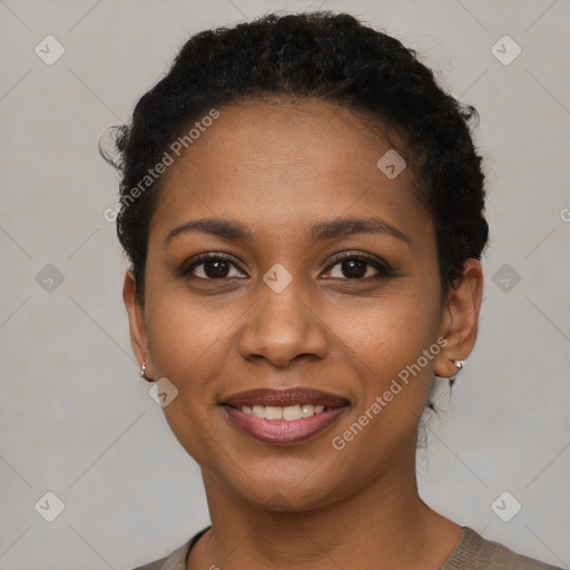 Joyful black young-adult female with short  brown hair and brown eyes