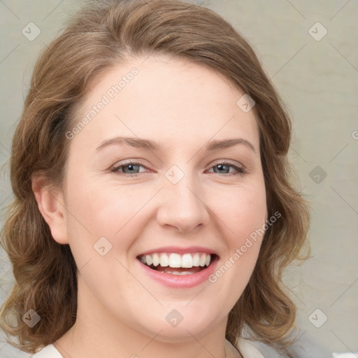 Joyful white young-adult female with medium  brown hair and green eyes