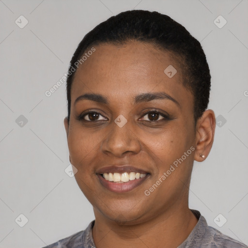 Joyful black young-adult female with short  black hair and brown eyes