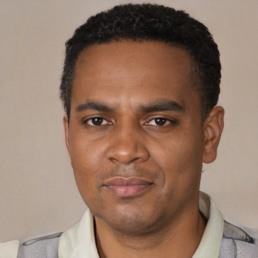 Neutral black young-adult male with short  black hair and brown eyes