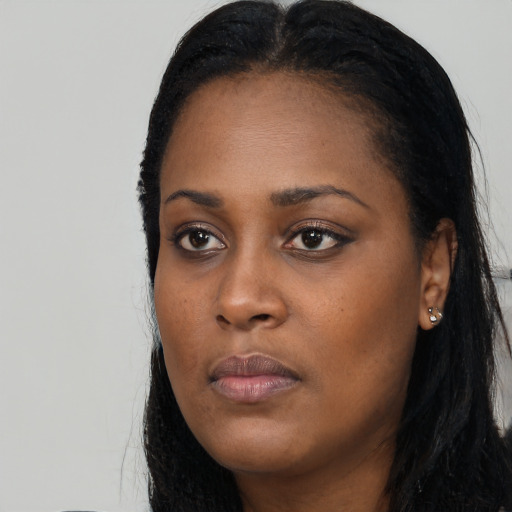 Neutral black young-adult female with long  black hair and brown eyes