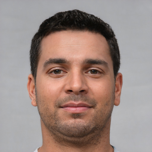 Neutral white young-adult male with short  black hair and brown eyes