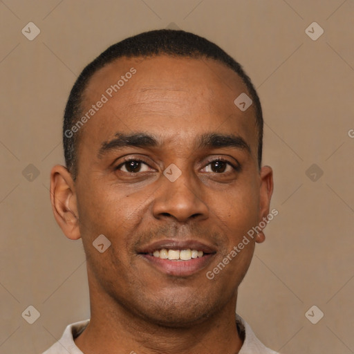 Joyful latino young-adult male with short  brown hair and brown eyes