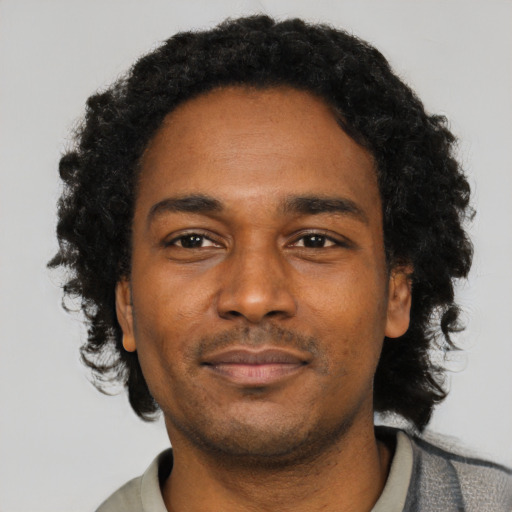 Neutral black adult male with short  black hair and brown eyes