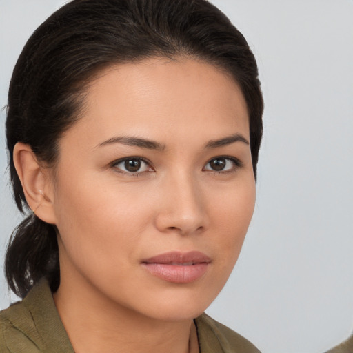 Joyful white young-adult female with medium  brown hair and brown eyes