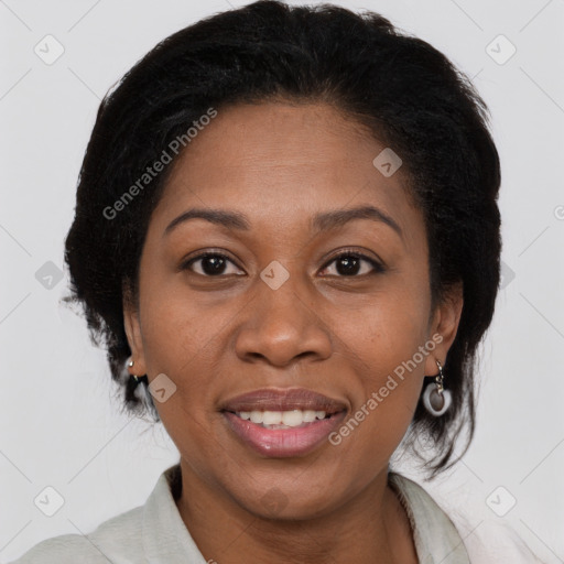 Joyful black adult female with medium  brown hair and brown eyes