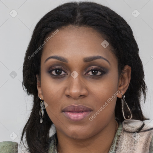 Joyful black young-adult female with long  black hair and brown eyes