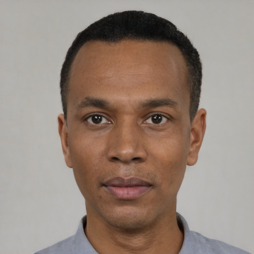Neutral black adult male with short  black hair and brown eyes