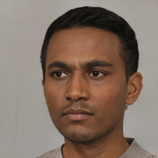 Neutral latino young-adult male with short  black hair and brown eyes