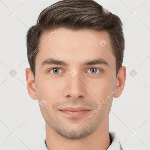 Joyful white young-adult male with short  brown hair and grey eyes