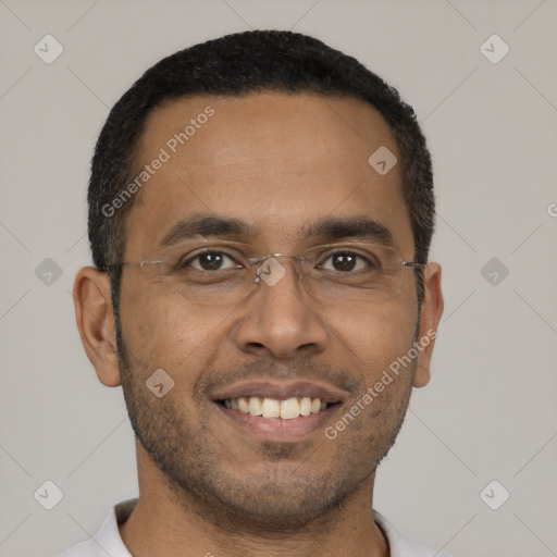 Joyful black young-adult male with short  black hair and brown eyes