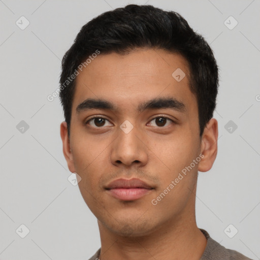 Neutral latino young-adult male with short  black hair and brown eyes