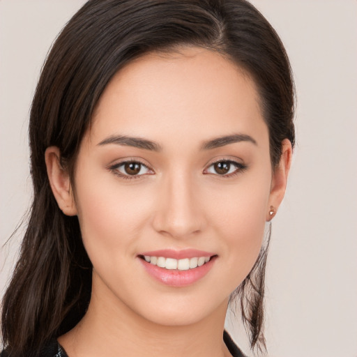 Joyful white young-adult female with long  brown hair and brown eyes