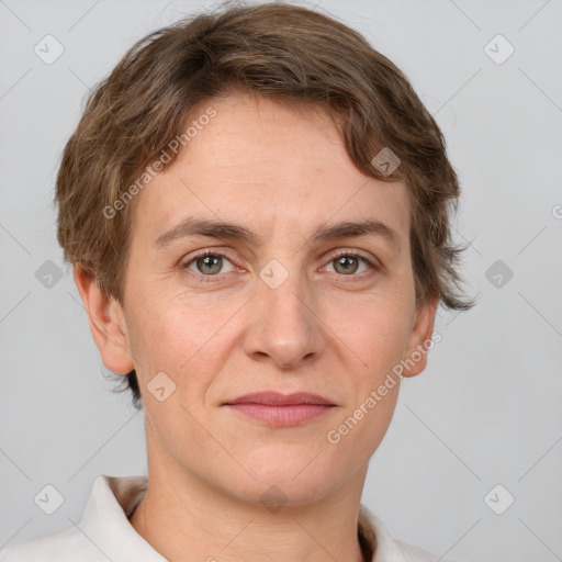 Joyful white adult male with short  brown hair and grey eyes