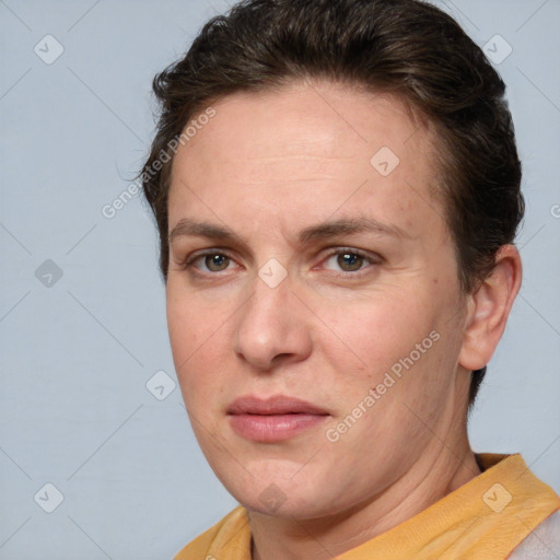 Joyful white adult female with short  brown hair and brown eyes