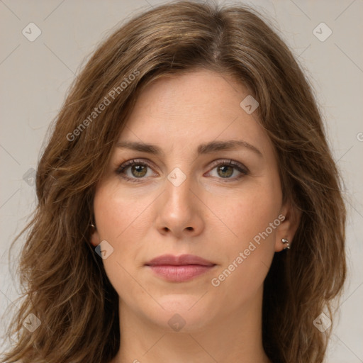 Joyful white young-adult female with long  brown hair and green eyes