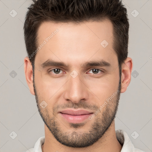 Joyful white young-adult male with short  brown hair and brown eyes