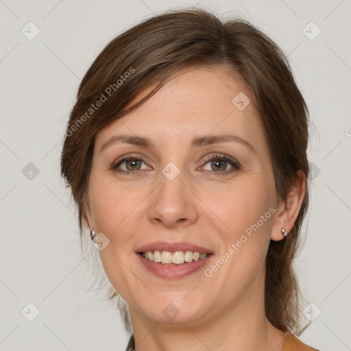 Joyful white adult female with medium  brown hair and grey eyes