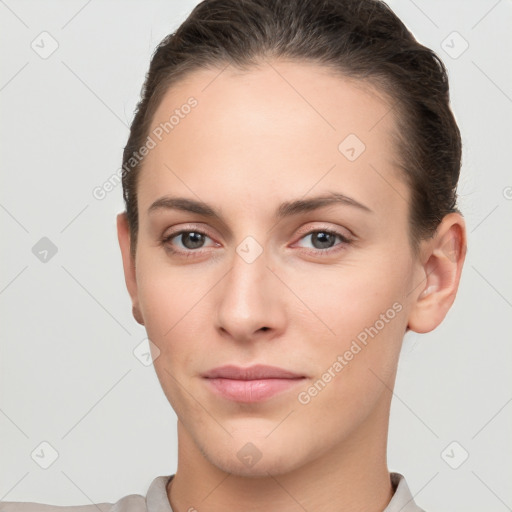 Neutral white young-adult female with short  brown hair and brown eyes