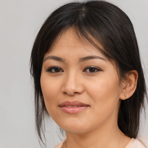 Joyful asian young-adult female with medium  brown hair and brown eyes
