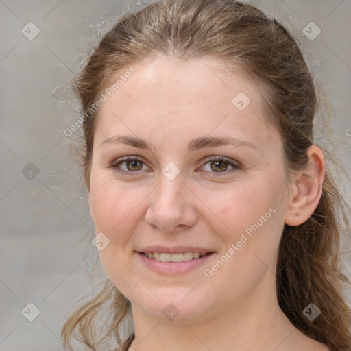 Joyful white young-adult female with medium  brown hair and grey eyes