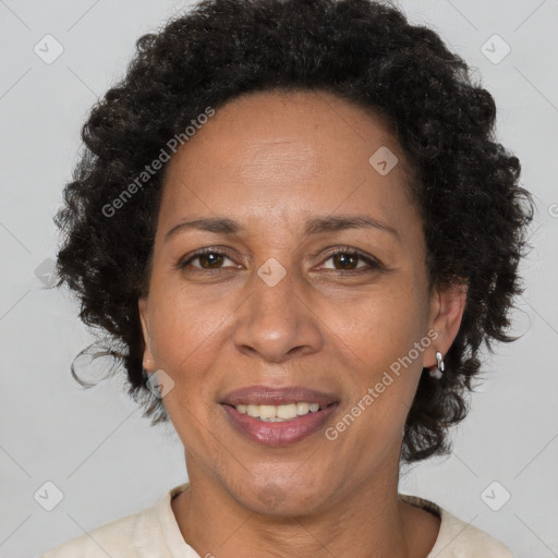 Joyful black adult female with short  brown hair and brown eyes