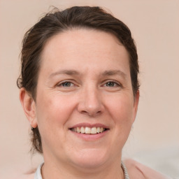 Joyful white adult female with short  brown hair and grey eyes