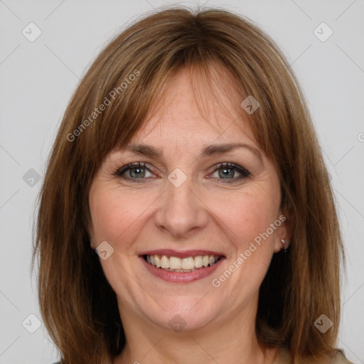 Joyful white adult female with medium  brown hair and grey eyes